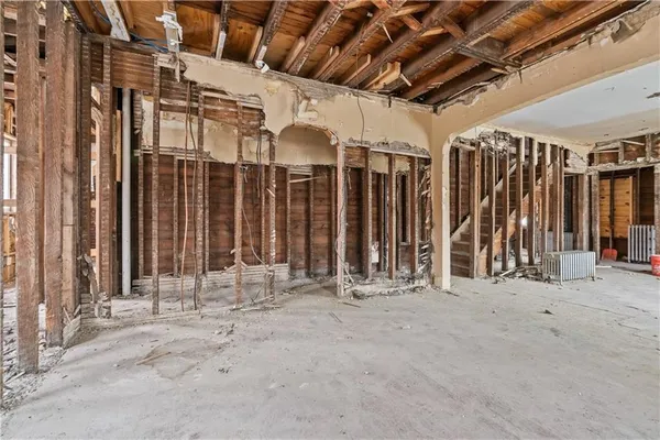 a view of a porch with wooden floor and stairs