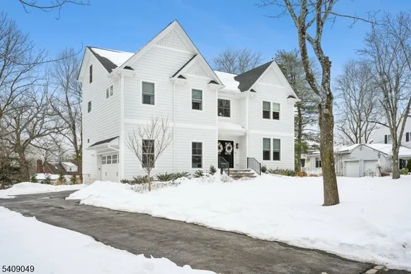 a view of white house with a snow