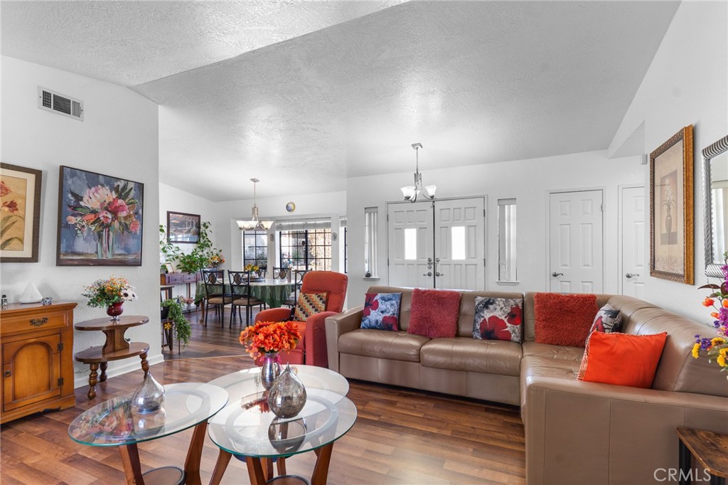 20071 Serrano Road Apple Valley, CA 92307 - Photo 11 of 38 a living room with furniture kitchen view and a large window