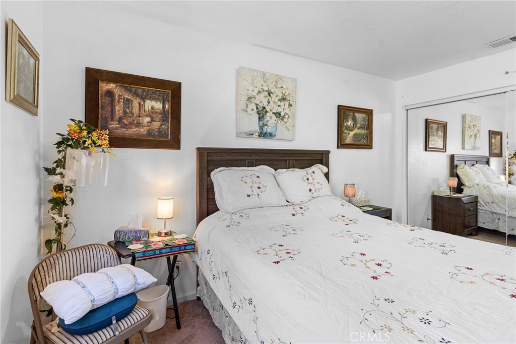 20071 Serrano Road Apple Valley, CA 92307 - Photo 20 of 38 a bedroom with bed and a couch