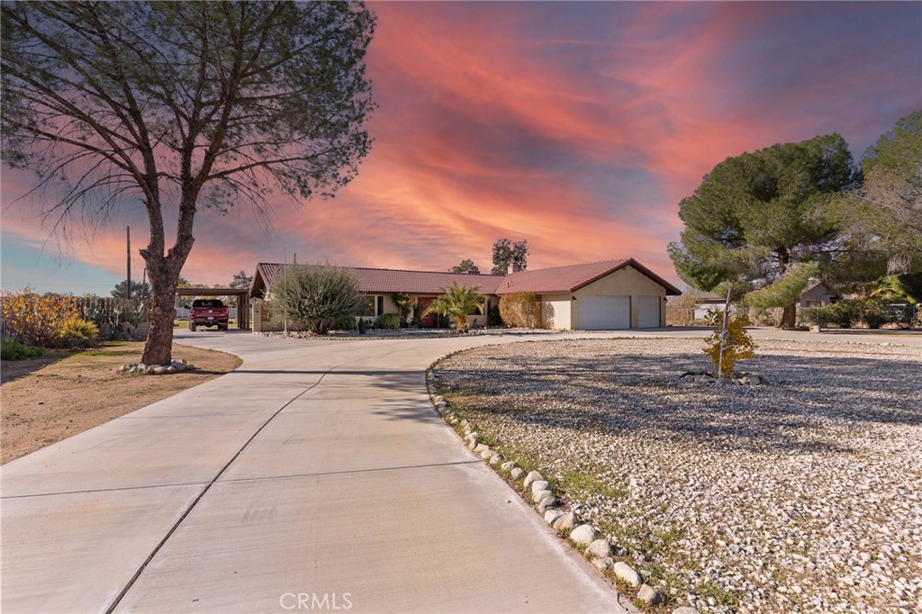 20071 Serrano Road Apple Valley, CA 92307 - Photo 2 of 38 a view of house with outdoor space and trees