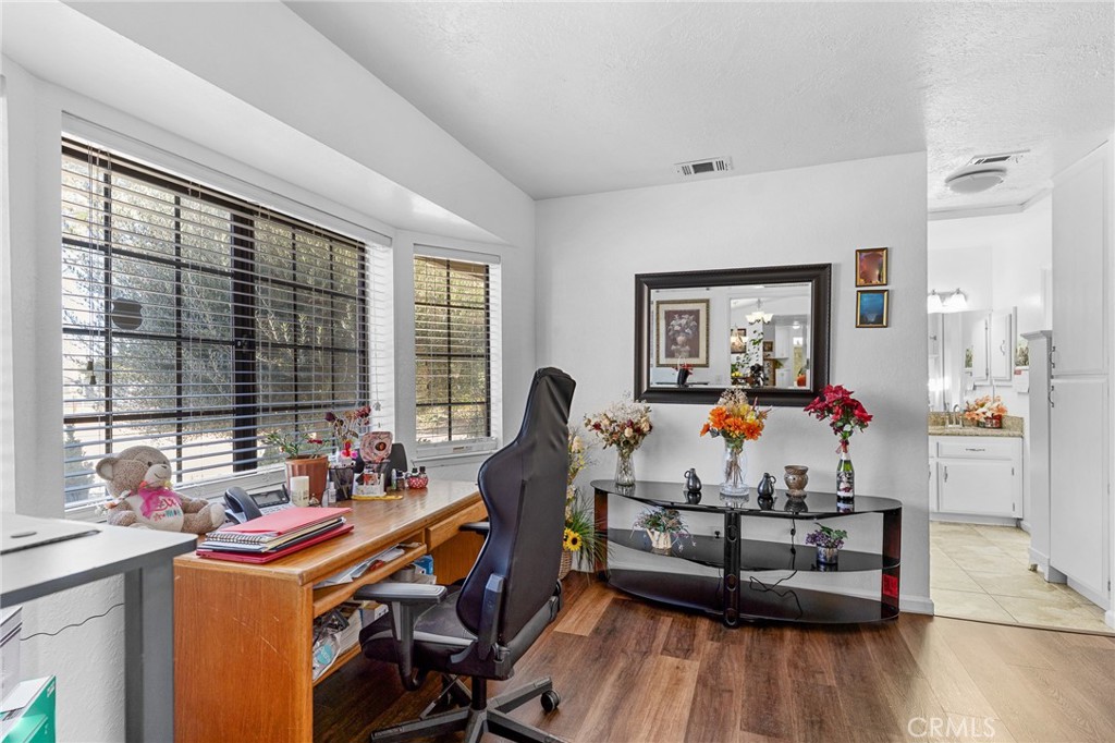 20071 Serrano Road Apple Valley, CA 92307 - Photo 24 of 38 a living room with furniture and a wooden floor
