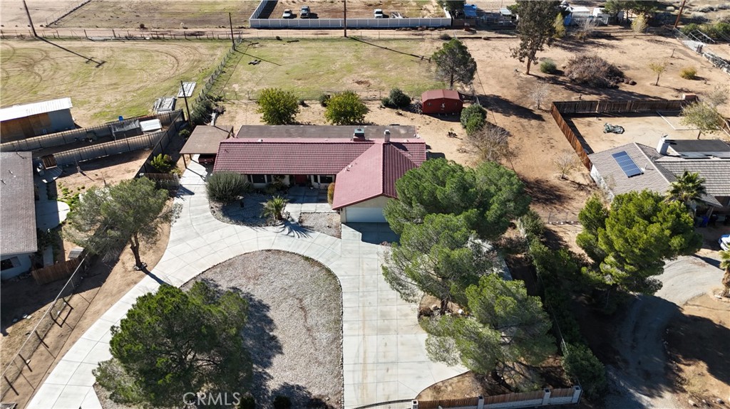 20071 Serrano Road Apple Valley, CA 92307 - Photo 30 of 38 an aerial view of a house with a yard and lake view