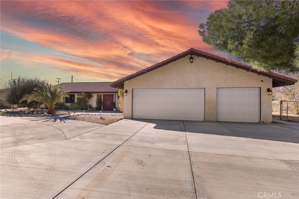 20071 Serrano Road Apple Valley, CA 92307 - Photo 3 of 38 a view of a house with backyard and trees