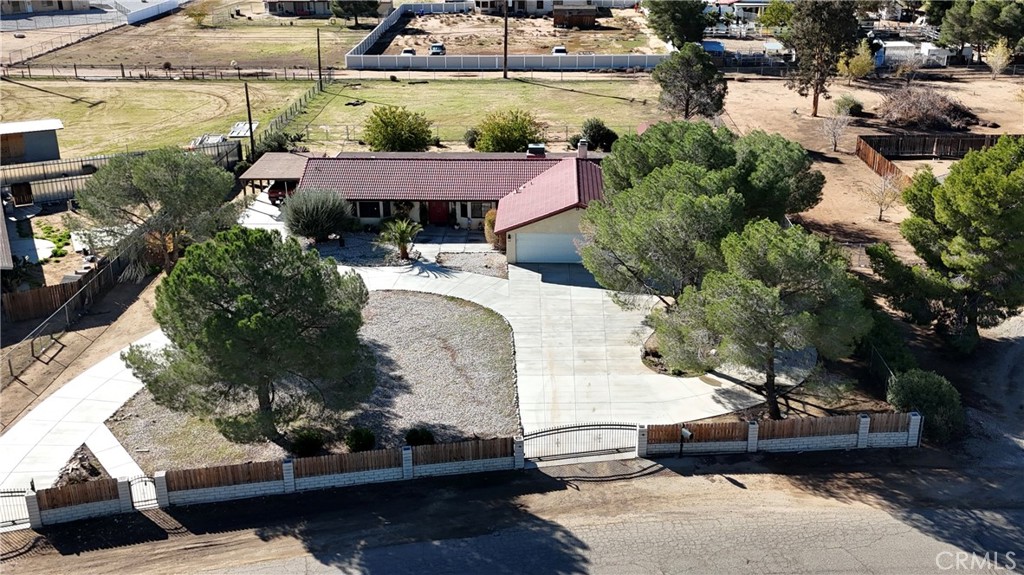 20071 Serrano Road Apple Valley, CA 92307 - Photo 33 of 38 a view of a house with a yard and sitting area