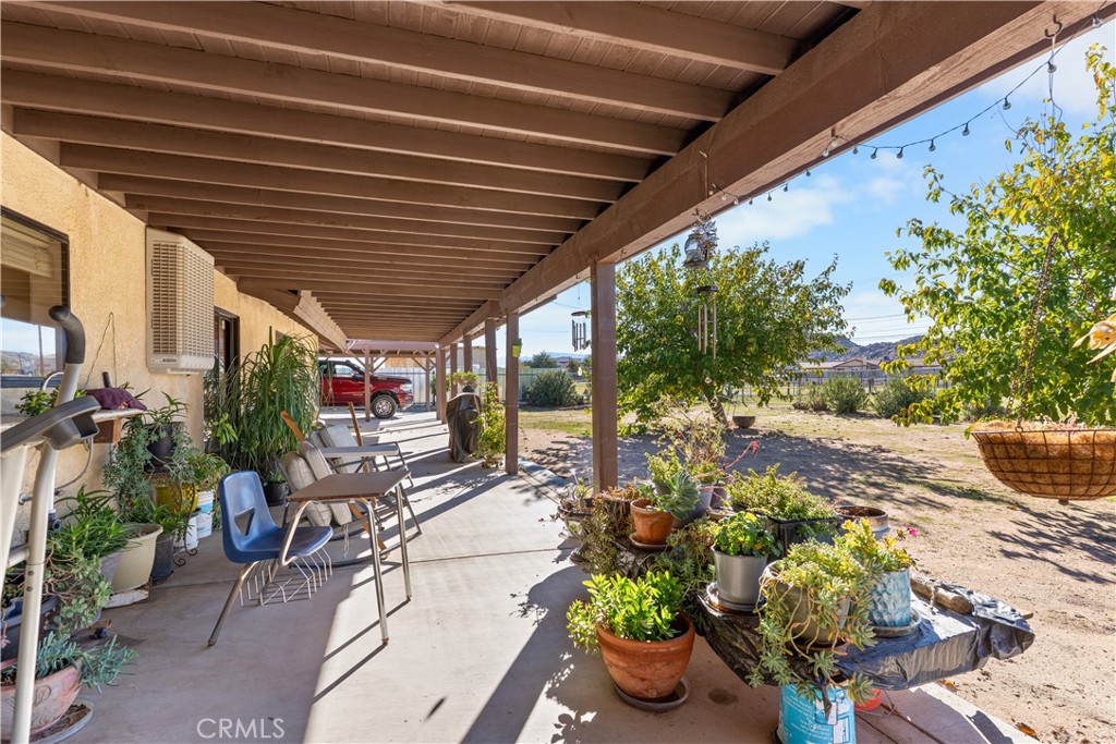 20071 Serrano Road Apple Valley, CA 92307 - Photo 7 of 38 a outdoor space with lots of potted plants