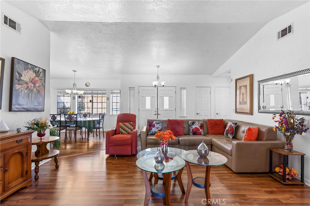 20071 Serrano Road Apple Valley, CA 92307 - Photo 8 of 38 a living room with furniture and wooden floor