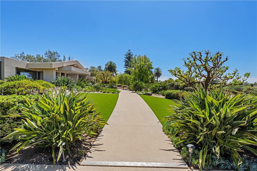 6533 Lago Lindo Rancho Santa Fe, CA 92067 - Photo 11 of 57 a view of a house with a yard and pathway