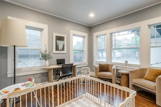 a bedroom with furniture and windows
