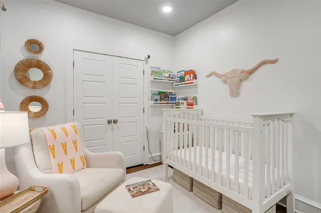 a bedroom with furniture and a window