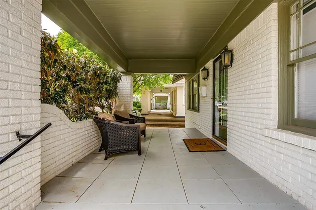 a view of two chairs in the balcony