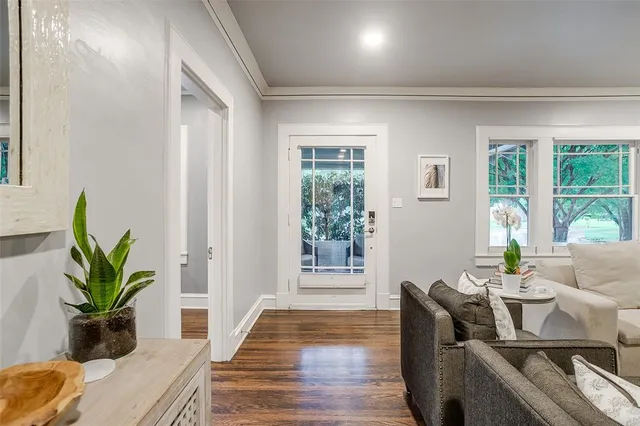 a view of a dining room with furniture and a potted plant