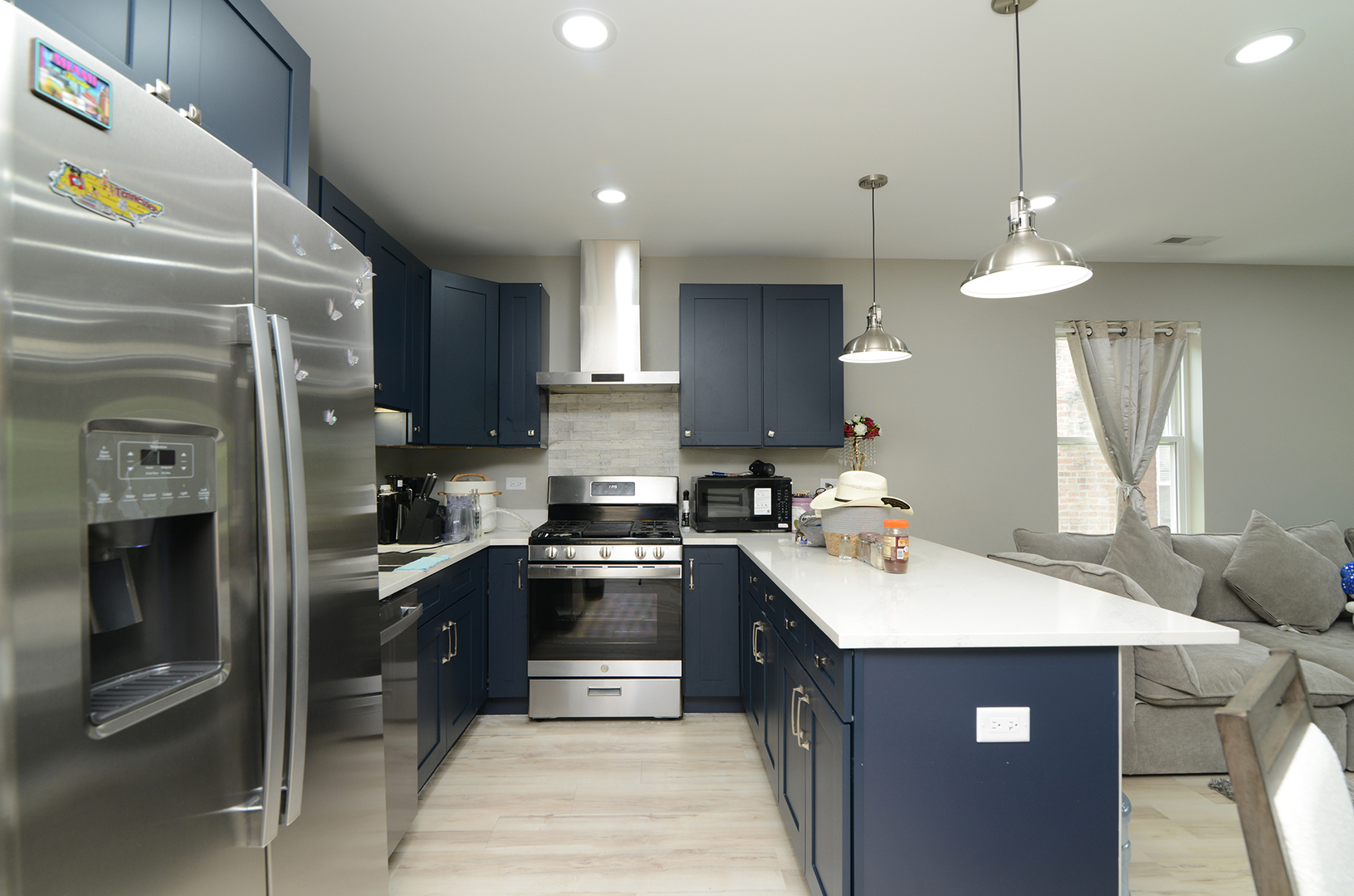 1051 North Springfield Avenue Chicago, IL 60651 - Photo 46 of 50 a kitchen with a sink a stove and refrigerator