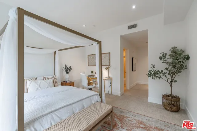 a bathroom with a sink vanity mirror and toilet