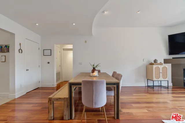a workspace with furniture and wooden floor