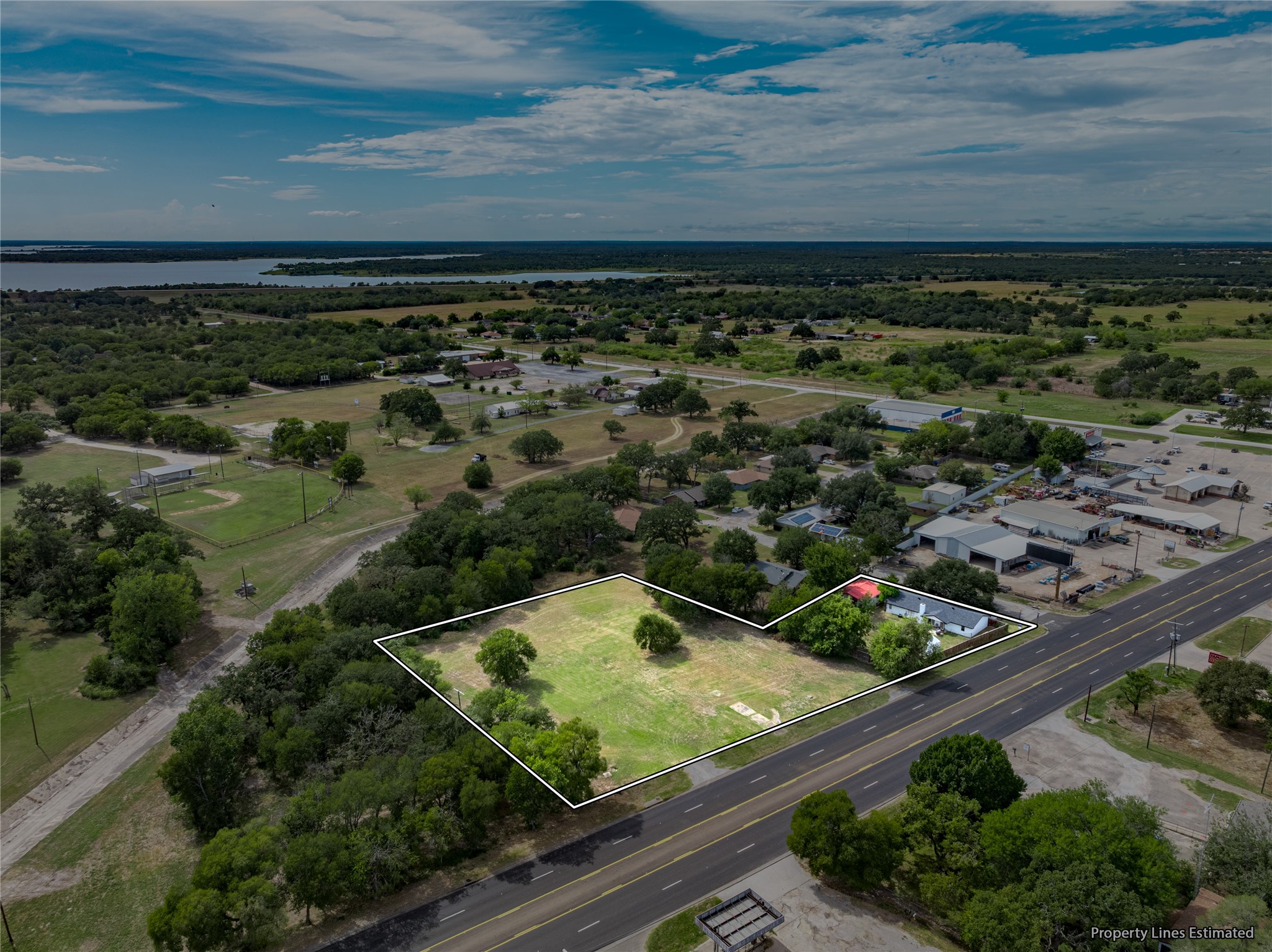 210 Rosa Lee Lane Somerville, TX 77879 - Photo 2 of 9 an aerial view of a residential houses with outdoor space