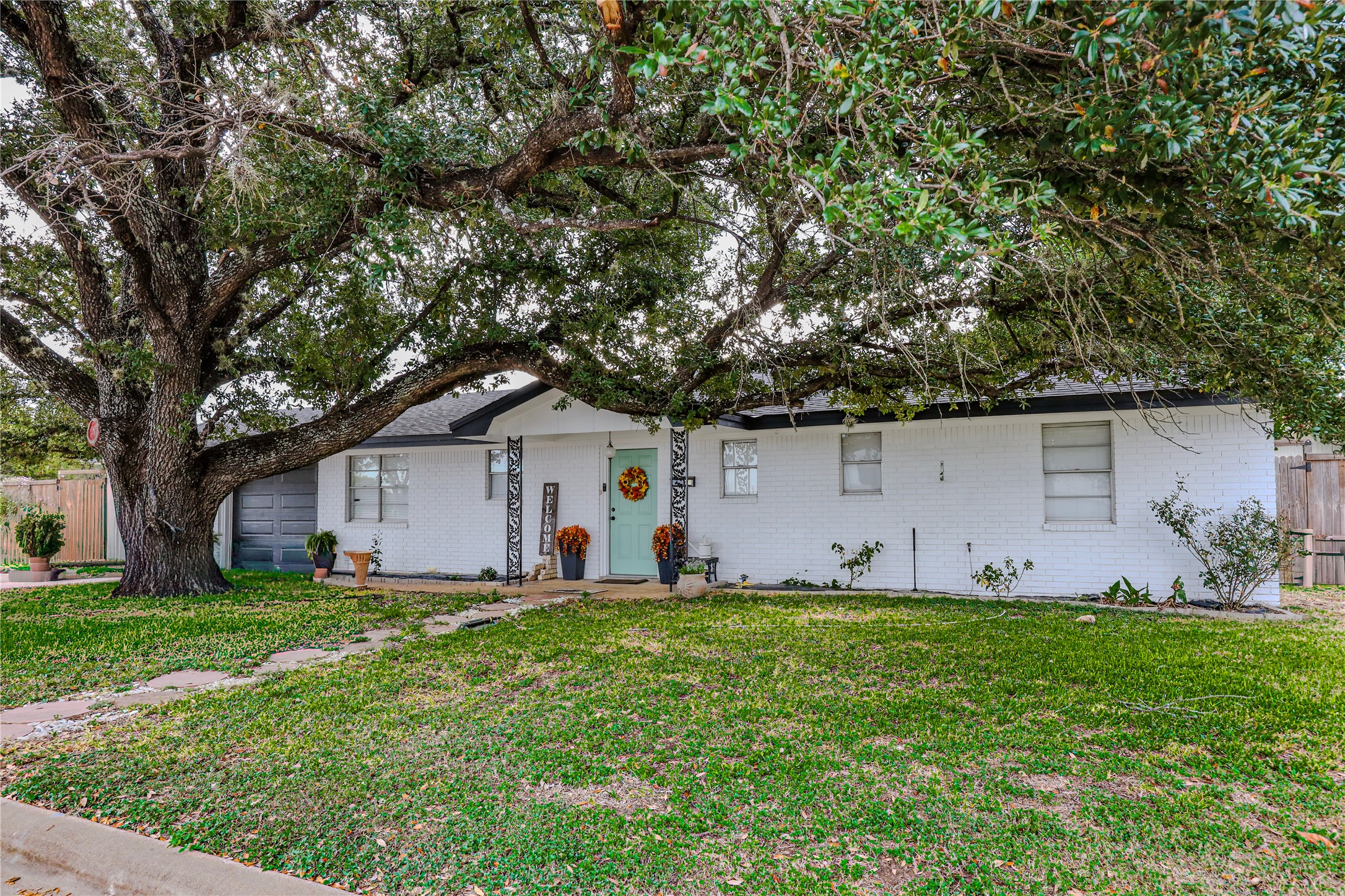 210 Rosa Lee Lane Somerville, TX 77879 - Photo 5 of 9 a house view with a garden and trees