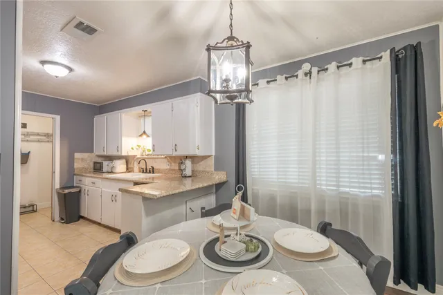 a kitchen with a sink stove and refrigerator