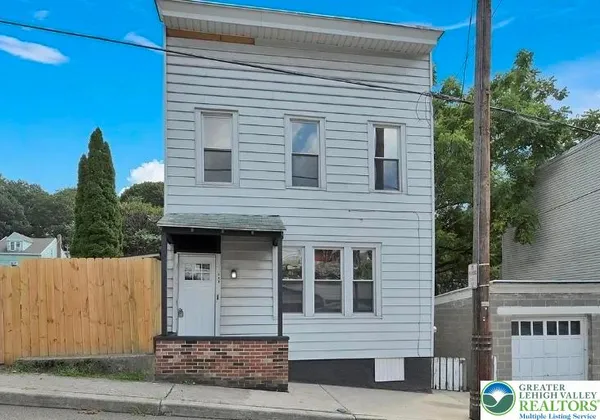 a front view of a house with a garage