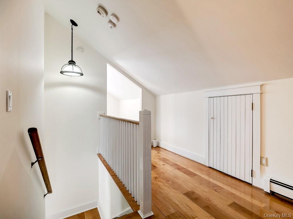 6 Bart Bull Road Middletown, NY 10941 - Photo 18 of 24 Corridor with lofted ceiling, an upstairs landing, hardwood / wood-style flooring, and a baseboard heating unit
