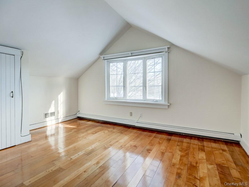 6 Bart Bull Road Middletown, NY 10941 - Photo 19 of 24 Bonus room with a baseboard heating unit, lofted ceiling, and light wood-type flooring