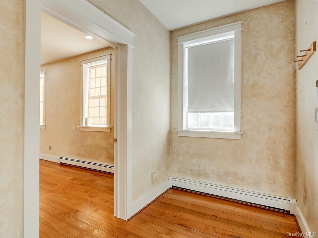 6 Bart Bull Road Middletown, NY 10941 - Photo 5 of 24 Unfurnished room with baseboard heating, healthy amount of natural light, light wood-style floors, and recessed lighting