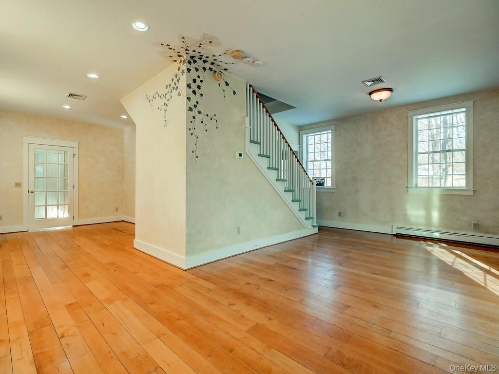 6 Bart Bull Road Middletown, NY 10941 - Photo 10 of 24 Unfurnished living room with light wood-style floors, stairs, baseboard heating, and recessed lighting
