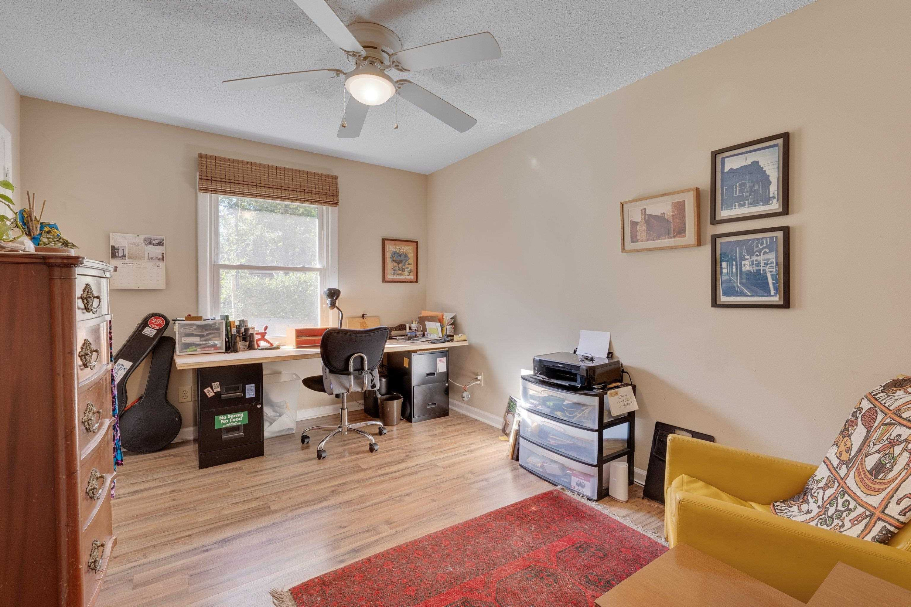 704 Wheat Mill Road Durham, NC 27704 - Photo 13 of 23 a living room with furniture and a flat screen tv