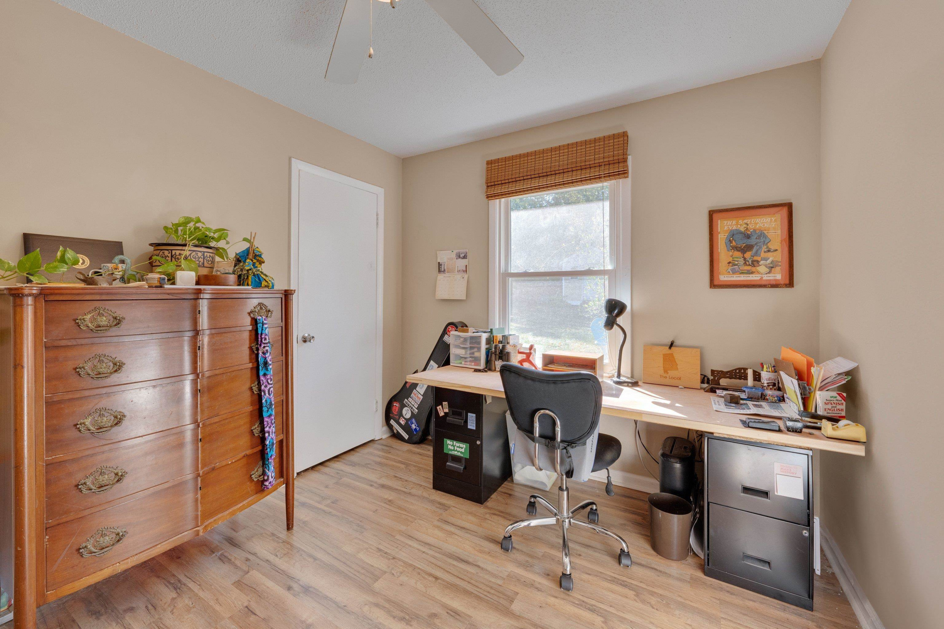 704 Wheat Mill Road Durham, NC 27704 - Photo 14 of 23 a view of a workspace with furniture and wooden floor