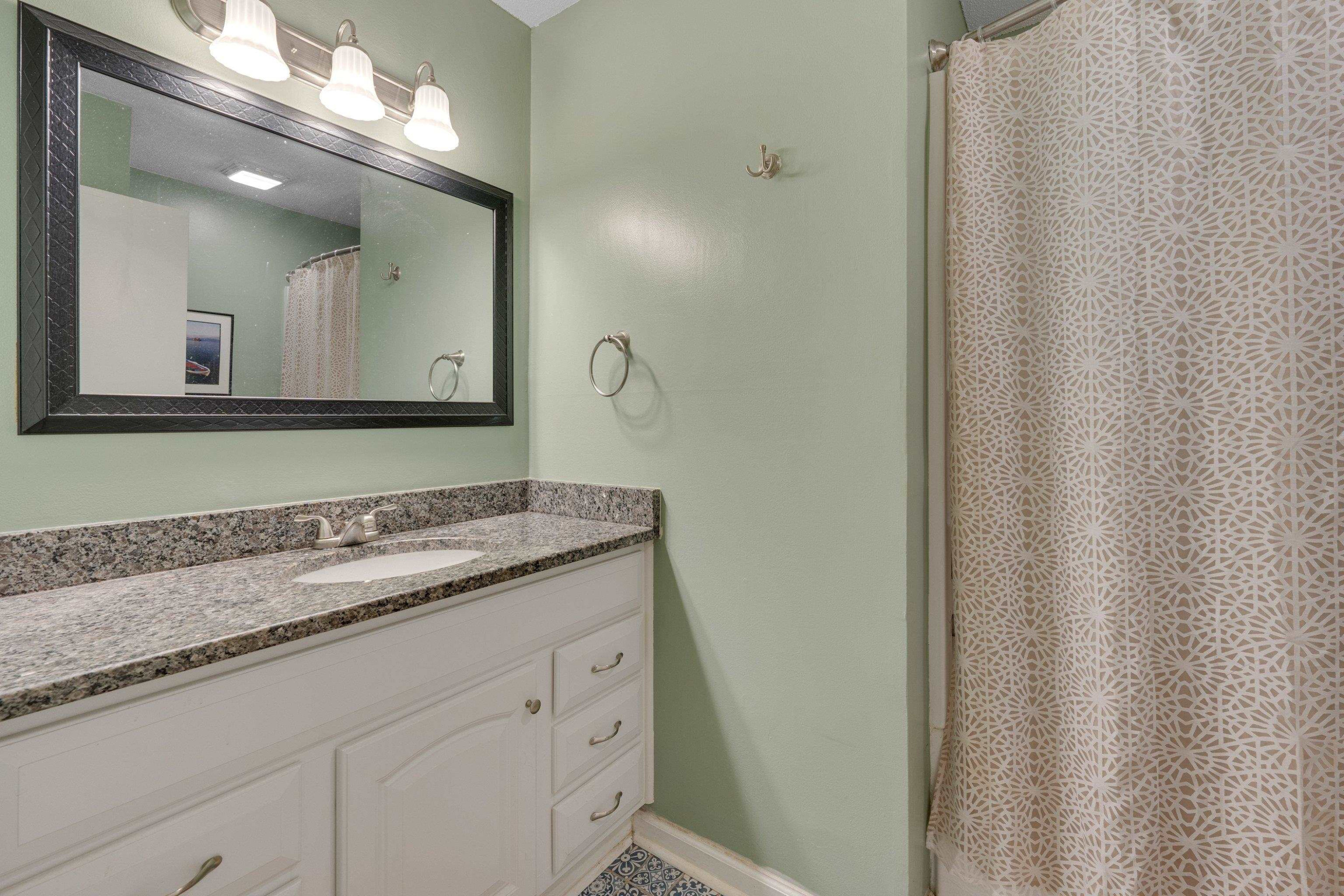 704 Wheat Mill Road Durham, NC 27704 - Photo 15 of 23 a bathroom with a granite countertop sink and a mirror