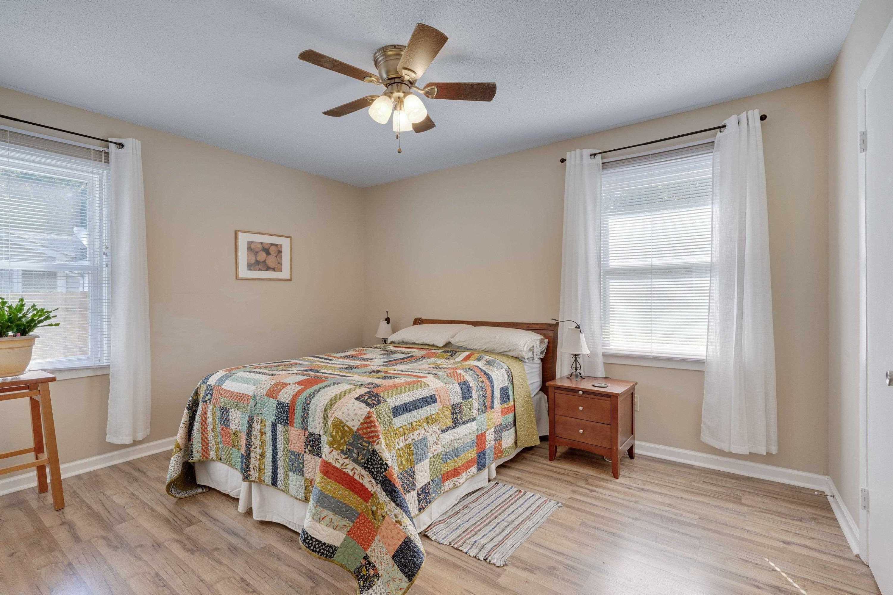 704 Wheat Mill Road Durham, NC 27704 - Photo 16 of 23 a bedroom with a bed and a window