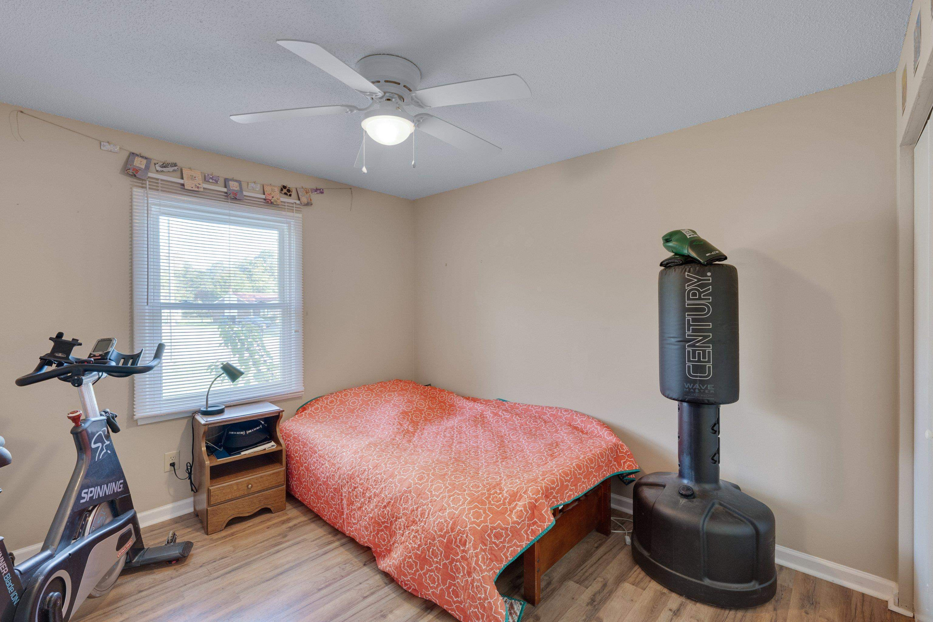 704 Wheat Mill Road Durham, NC 27704 - Photo 20 of 23 a bedroom with a bed and a table