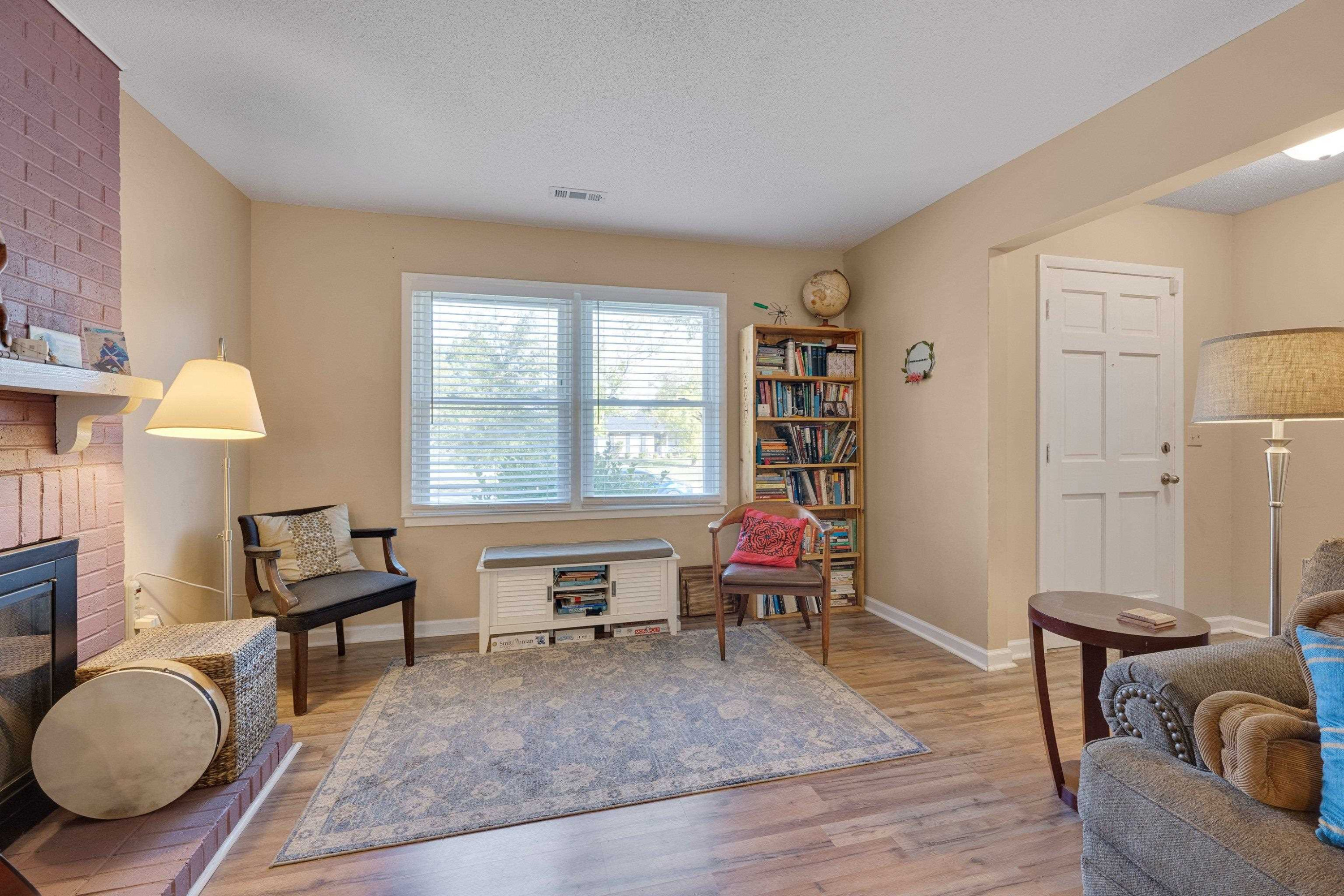 704 Wheat Mill Road Durham, NC 27704 - Photo 4 of 23 a living room with furniture and a wooden floor