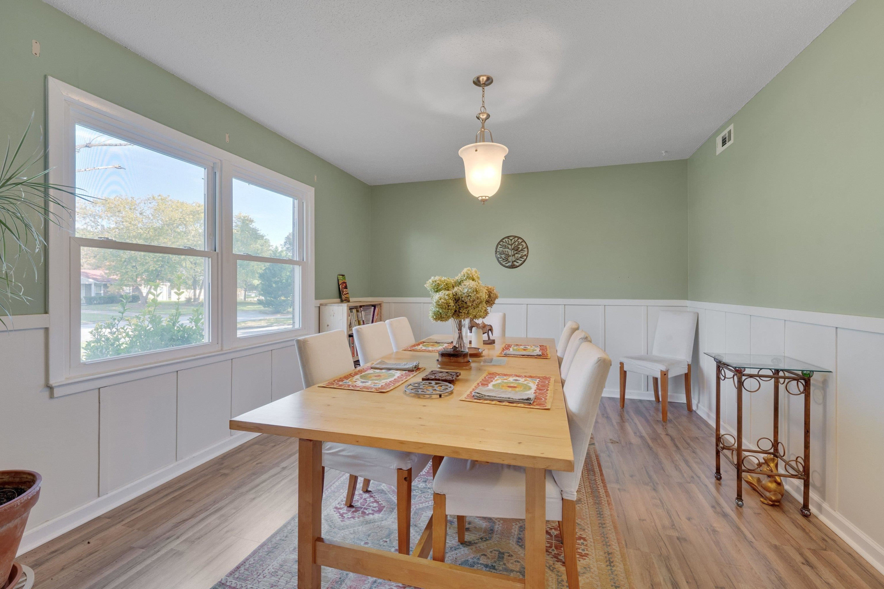 704 Wheat Mill Road Durham, NC 27704 - Photo 8 of 23 a view of a dining room with furniture window and wooden floor