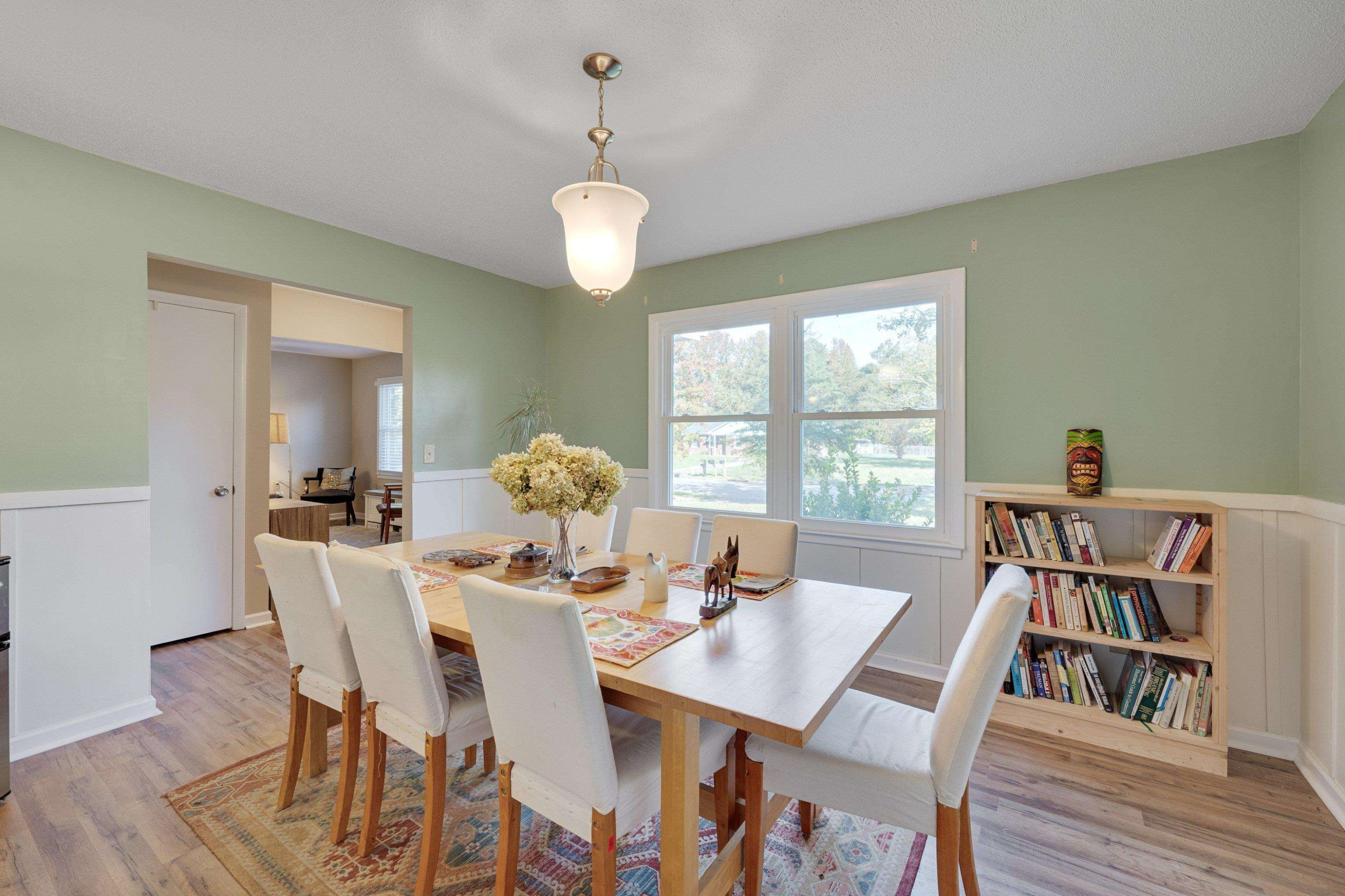 704 Wheat Mill Road Durham, NC 27704 - Photo 9 of 23 a view of a dining room with furniture window and wooden floor