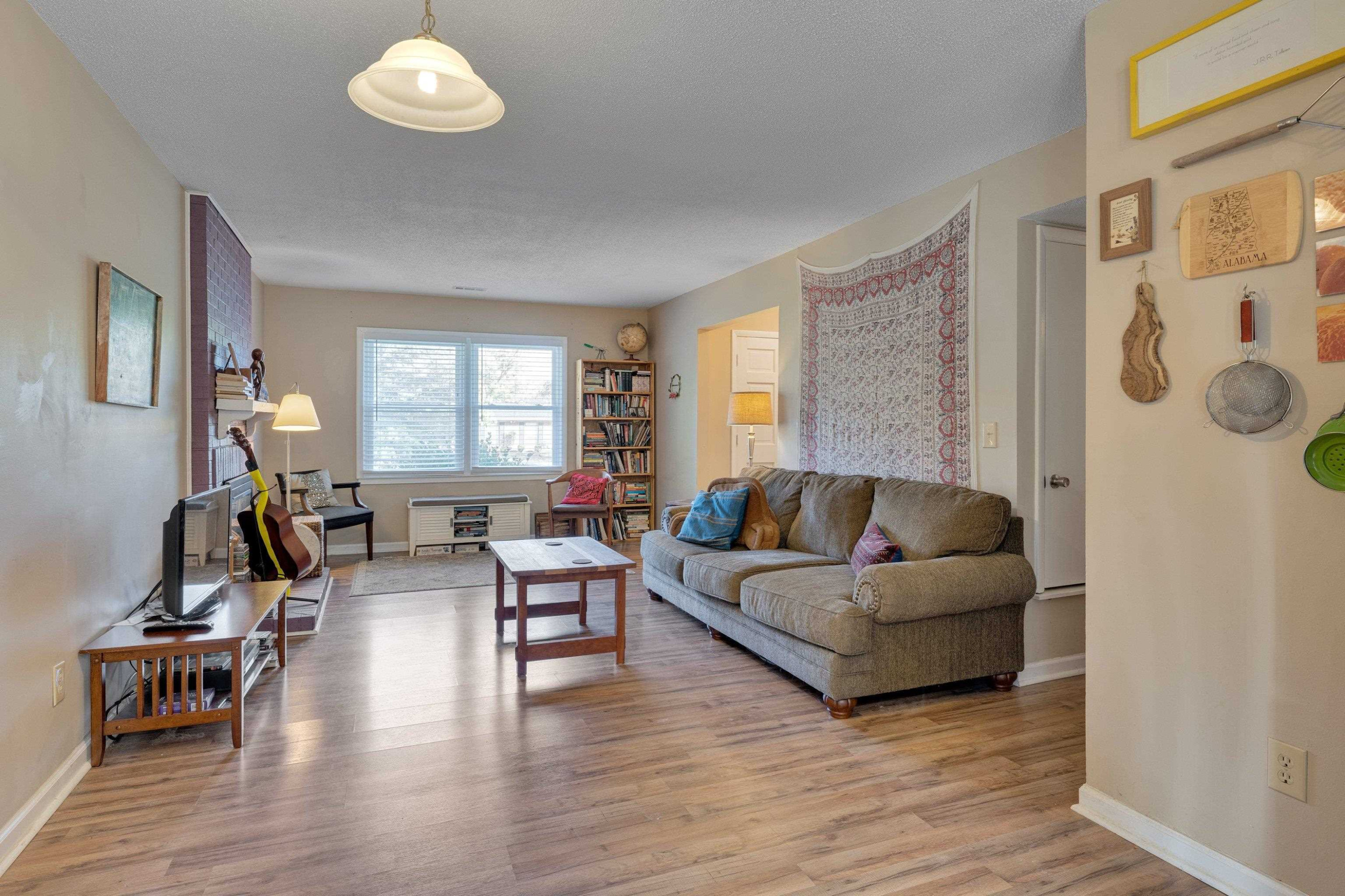 704 Wheat Mill Road Durham, NC 27704 - Photo 10 of 23 a living room with furniture and wooden floor