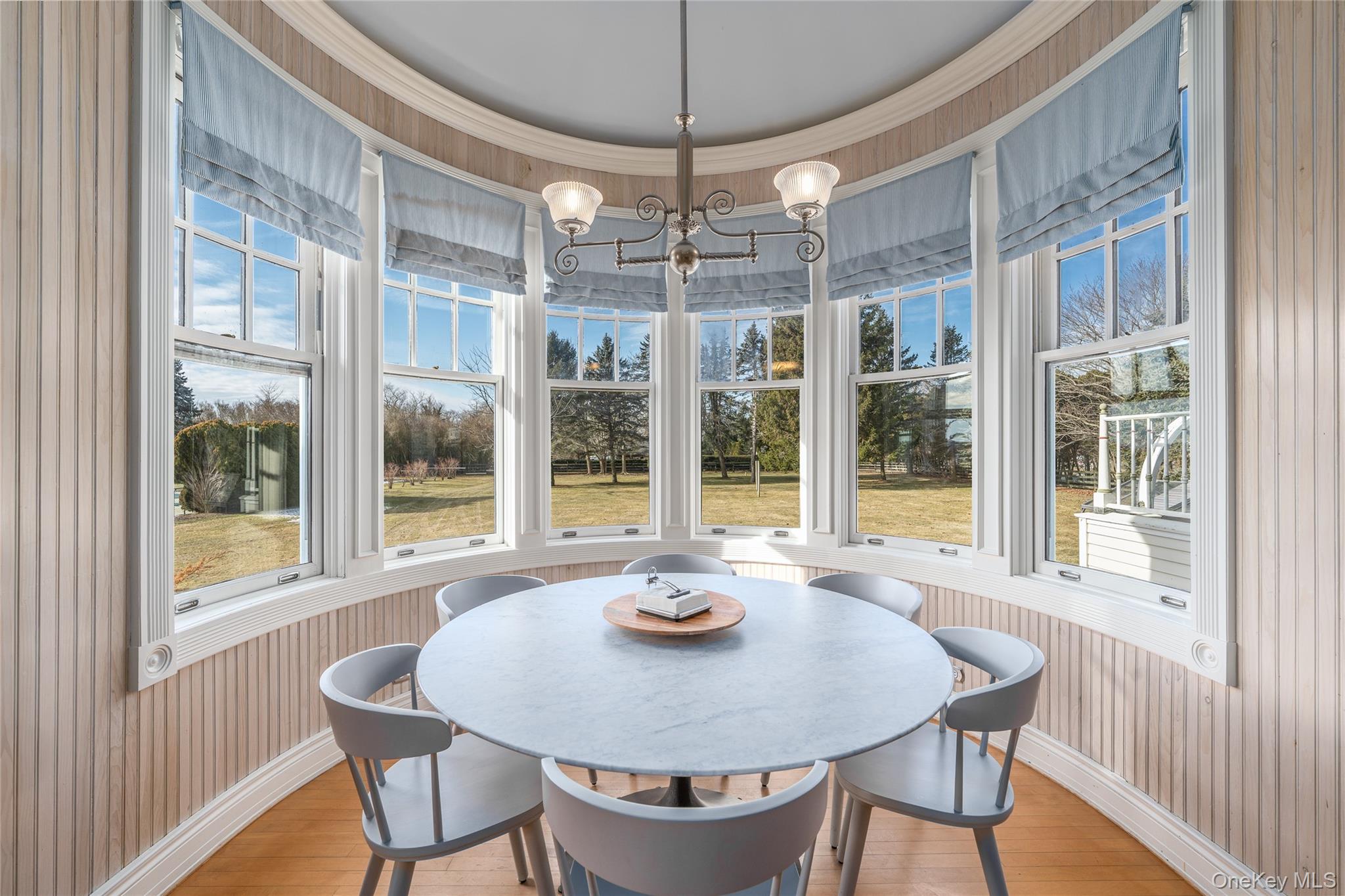 6133 Sound Avenue Riverhead, NY 11901 - Photo 22 of 42 a view of a dining room with furniture window and outside view