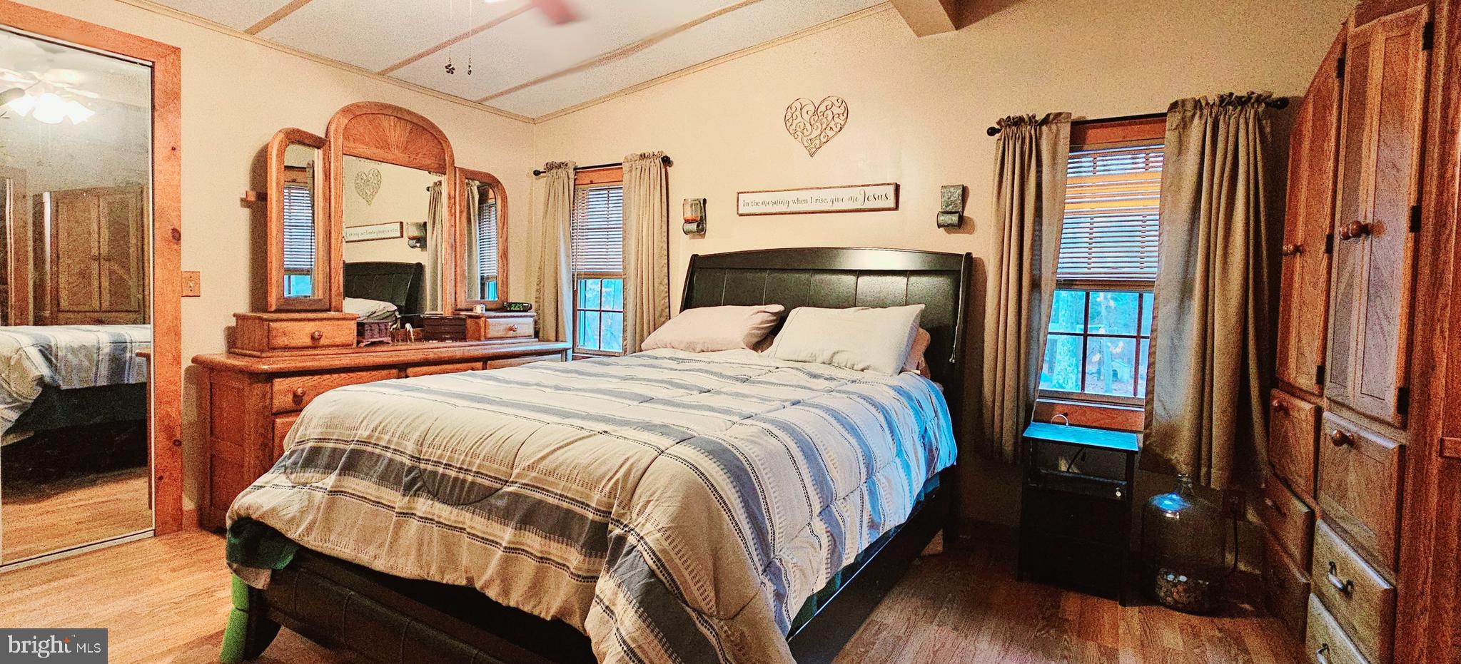 2 Dare Avenue Heislerville, NJ 08324 - Photo 12 of 22 a bedroom with a bed table and a large mirror