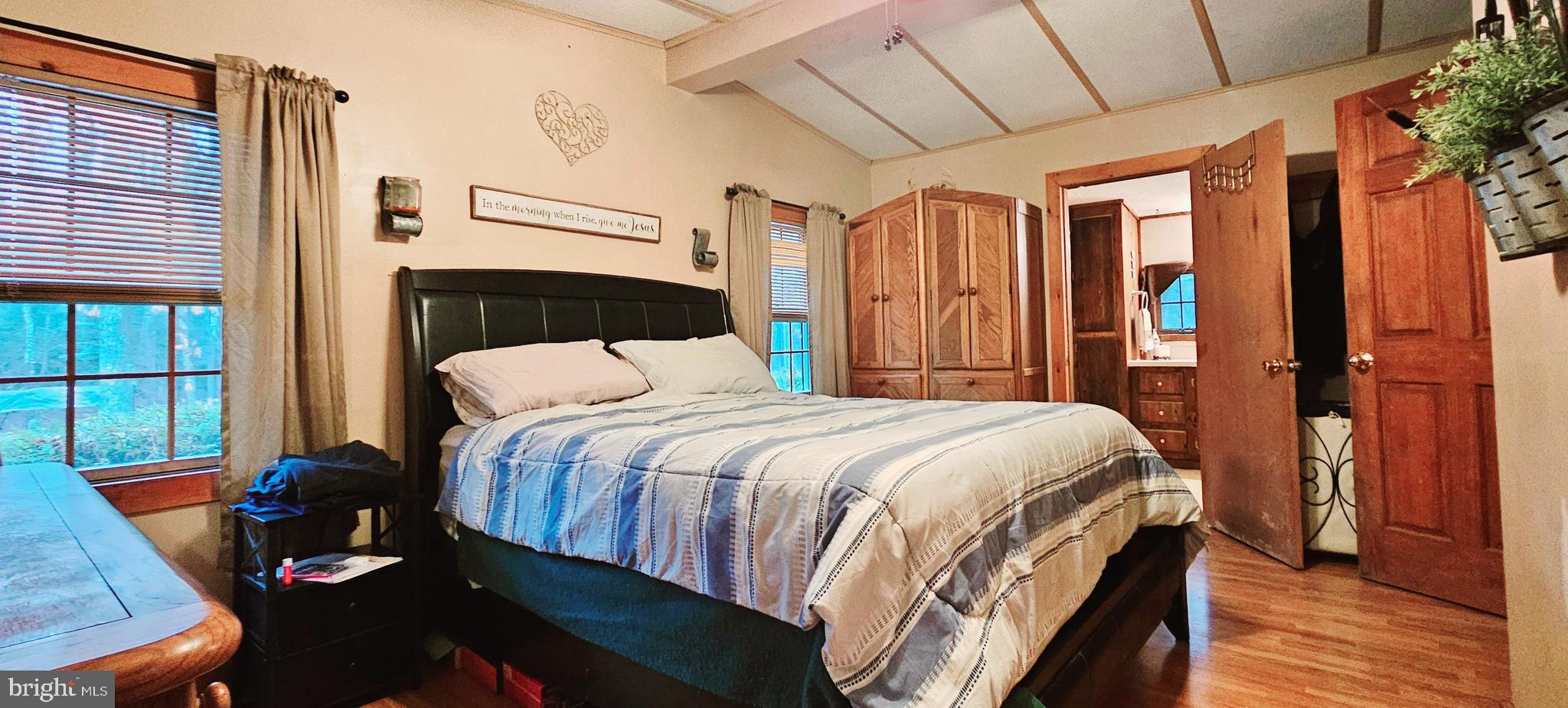 2 Dare Avenue Heislerville, NJ 08324 - Photo 13 of 22 a bed sitting in a bedroom next to a window