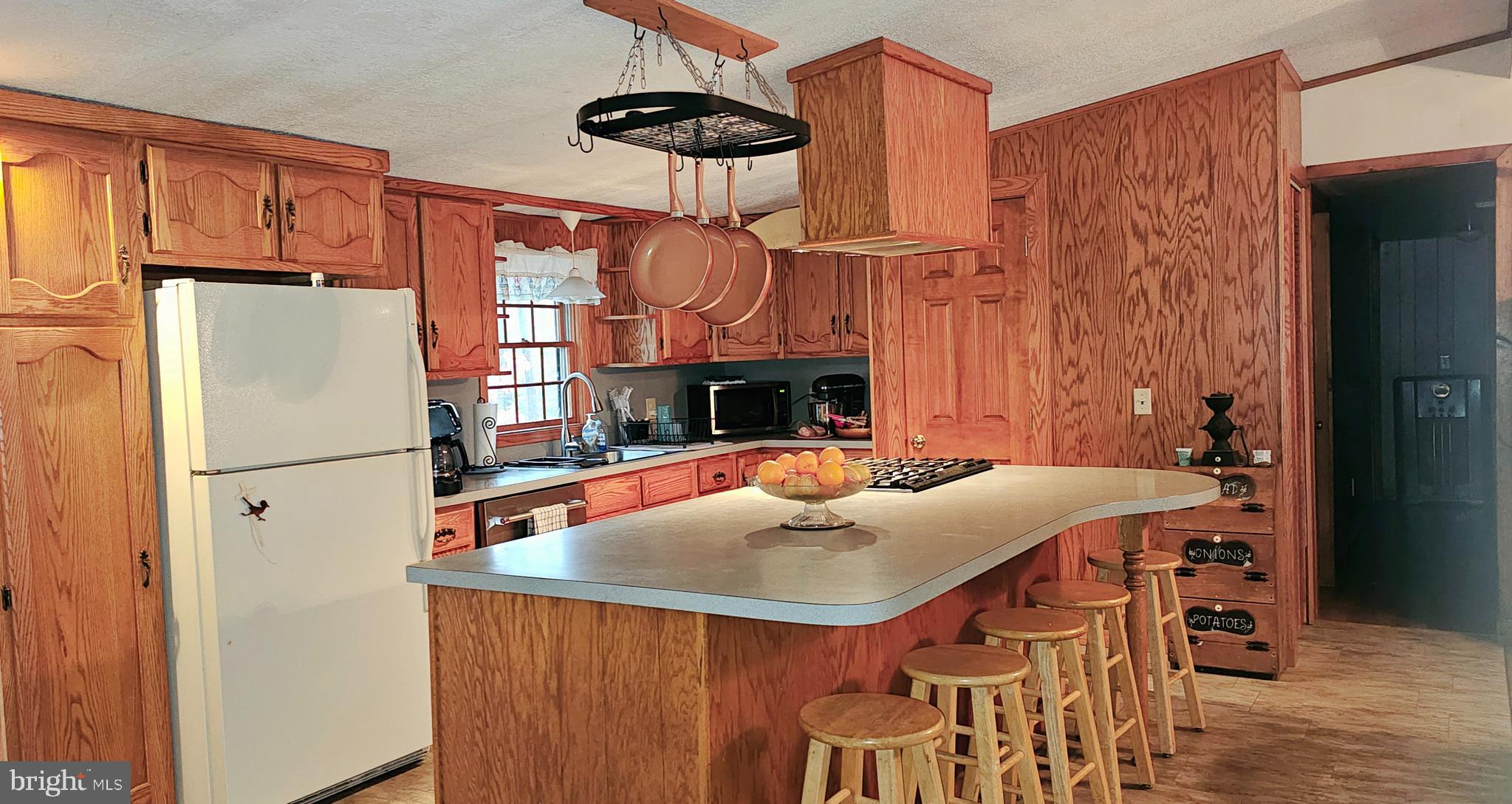 2 Dare Avenue Heislerville, NJ 08324 - Photo 5 of 22 a view of kitchen island with furniture a refrigerator and wooden floor
