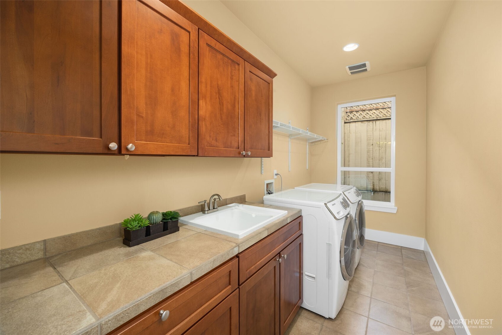 18638 92nd Avenue Northeast Bothell, WA 98011 - Photo 38 of 40 a utility room with a sink a cabinetry and appliances