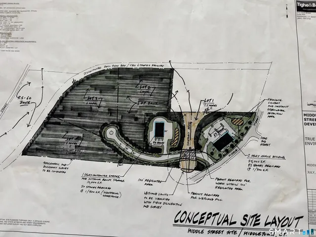 a view of water heater and living room