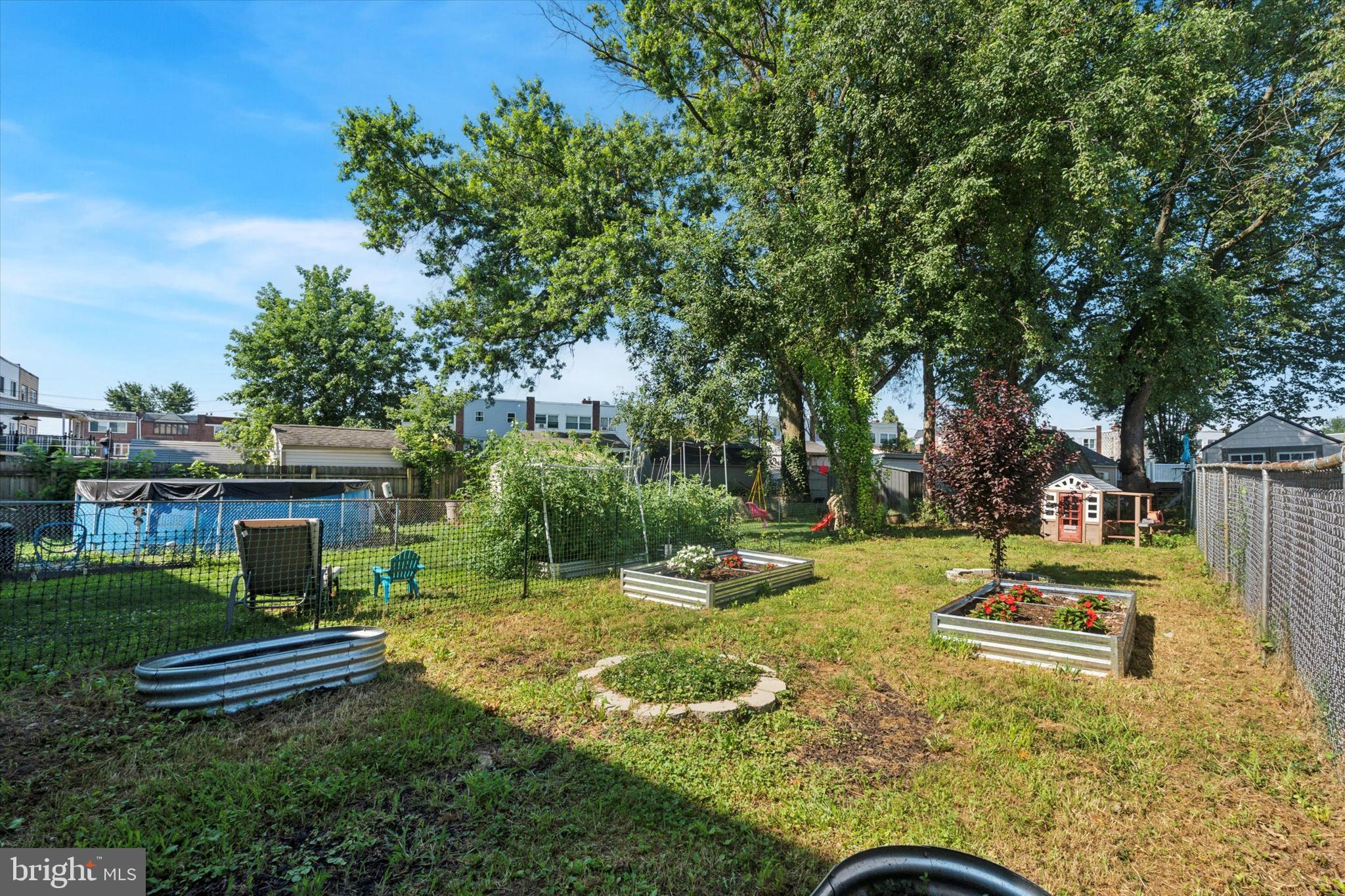 12218 Aster Road Philadelphia, PA 19154 - Photo 24 of 25 a swimming pool with some trees in the background