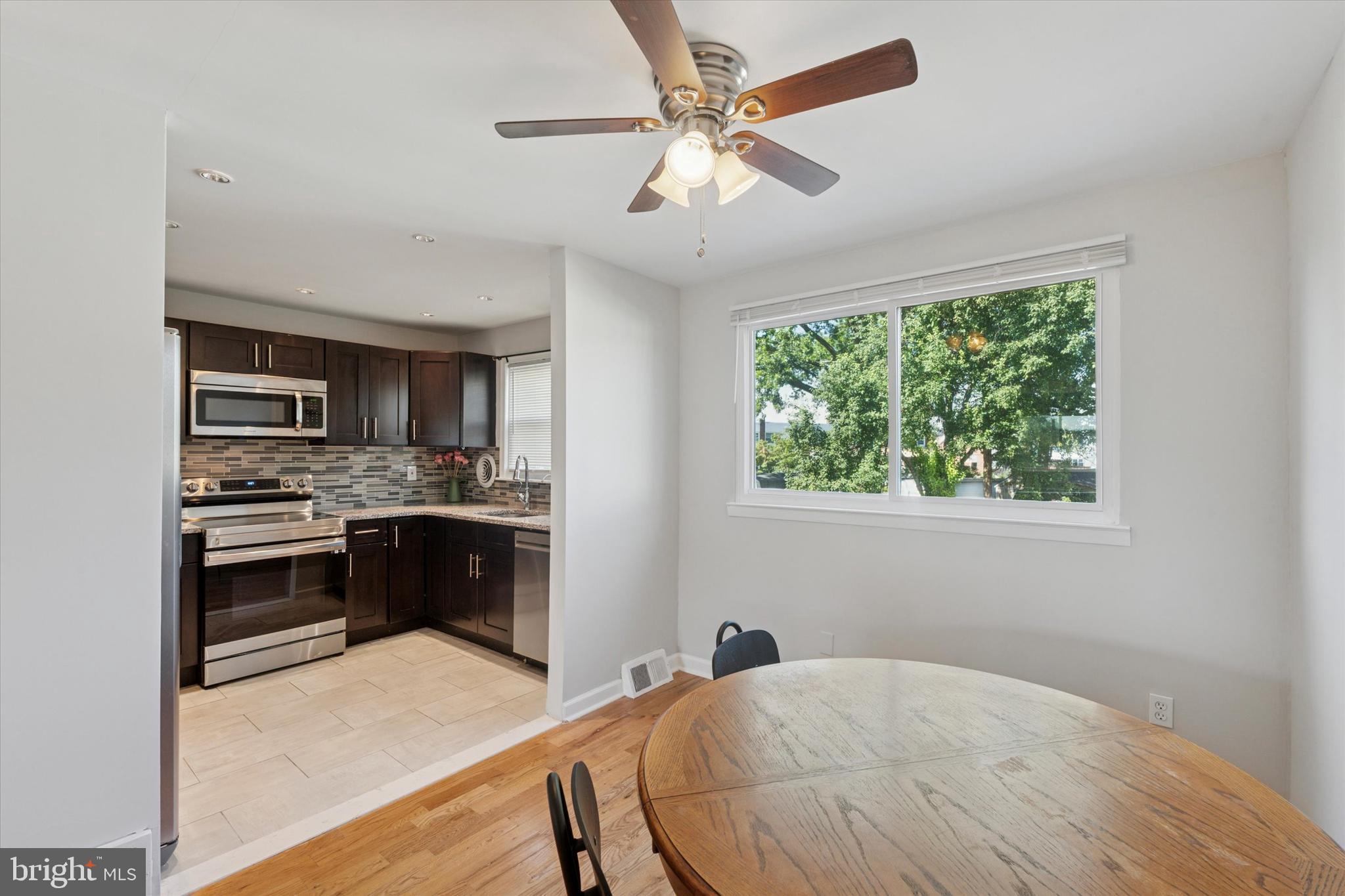 12218 Aster Road Philadelphia, PA 19154 - Photo 3 of 25 a kitchen with a stove a refrigerator and a sink
