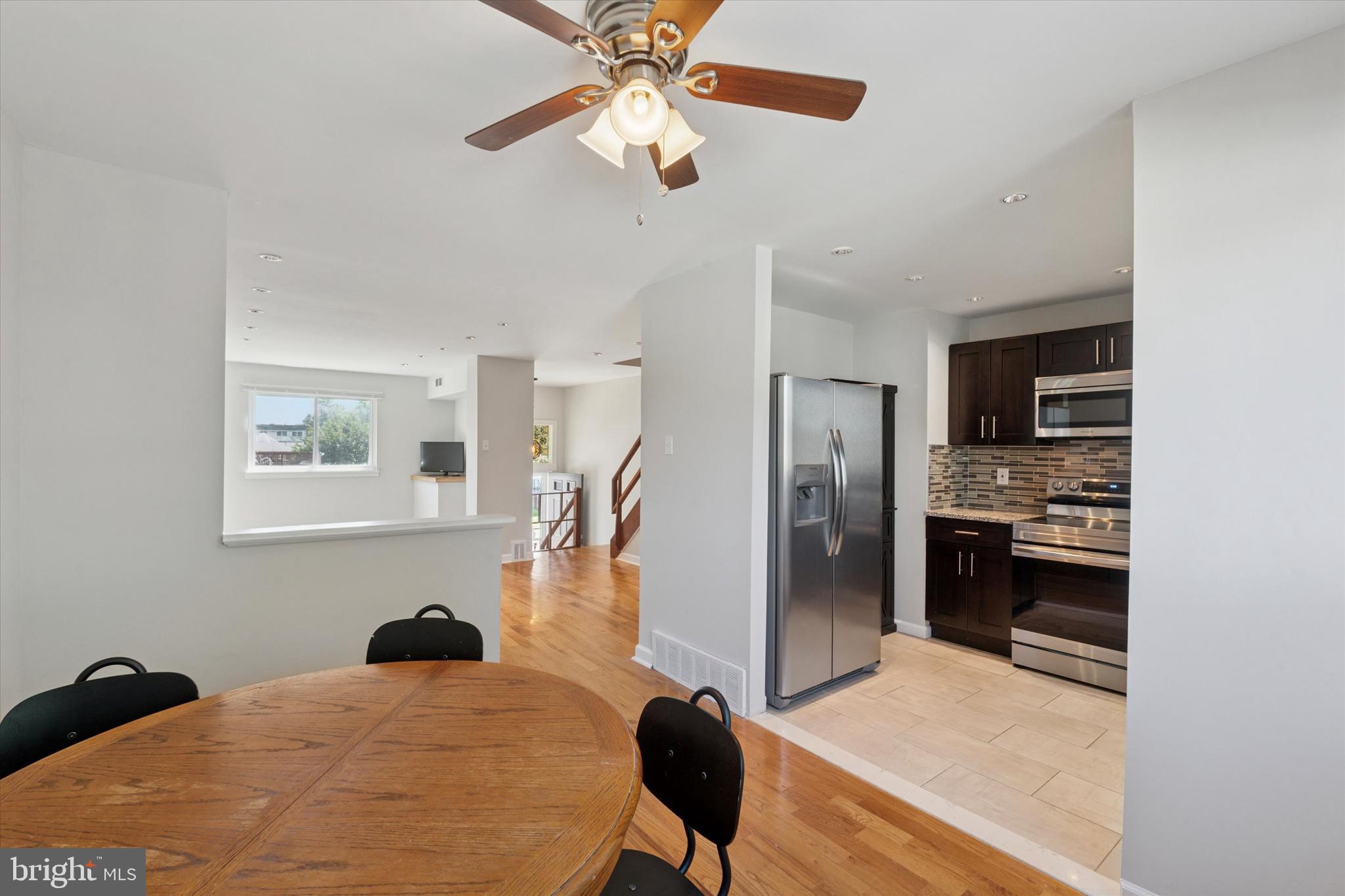 12218 Aster Road Philadelphia, PA 19154 - Photo 4 of 25 a bedroom with a bed and a chandelier