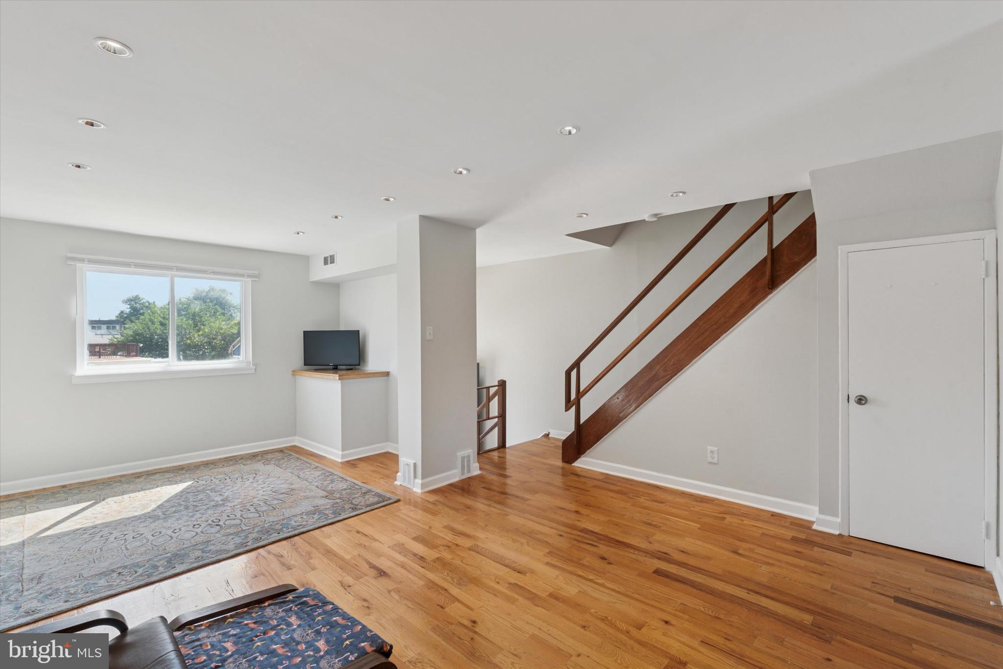 12218 Aster Road Philadelphia, PA 19154 - Photo 6 of 25 a view of hallway with window and wooden floor