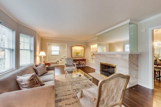 1317 Lyons Street Evanston, IL 60201 - Photo 14 of 46 a living room with furniture large window and a fireplace