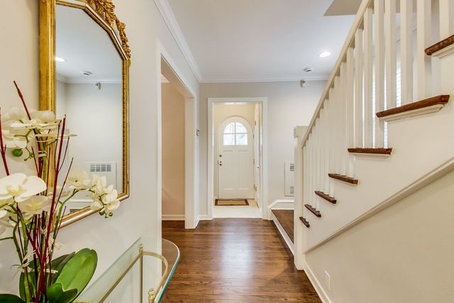1317 Lyons Street Evanston, IL 60201 - Photo 5 of 46 a view of a hallway with wooden floor and stairs