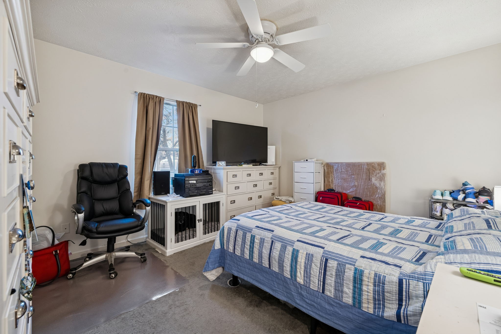 1337 Oaklawn Road Chapmansboro, TN 37035 - Photo 15 of 37 a bedroom with a bed and a flat screen tv