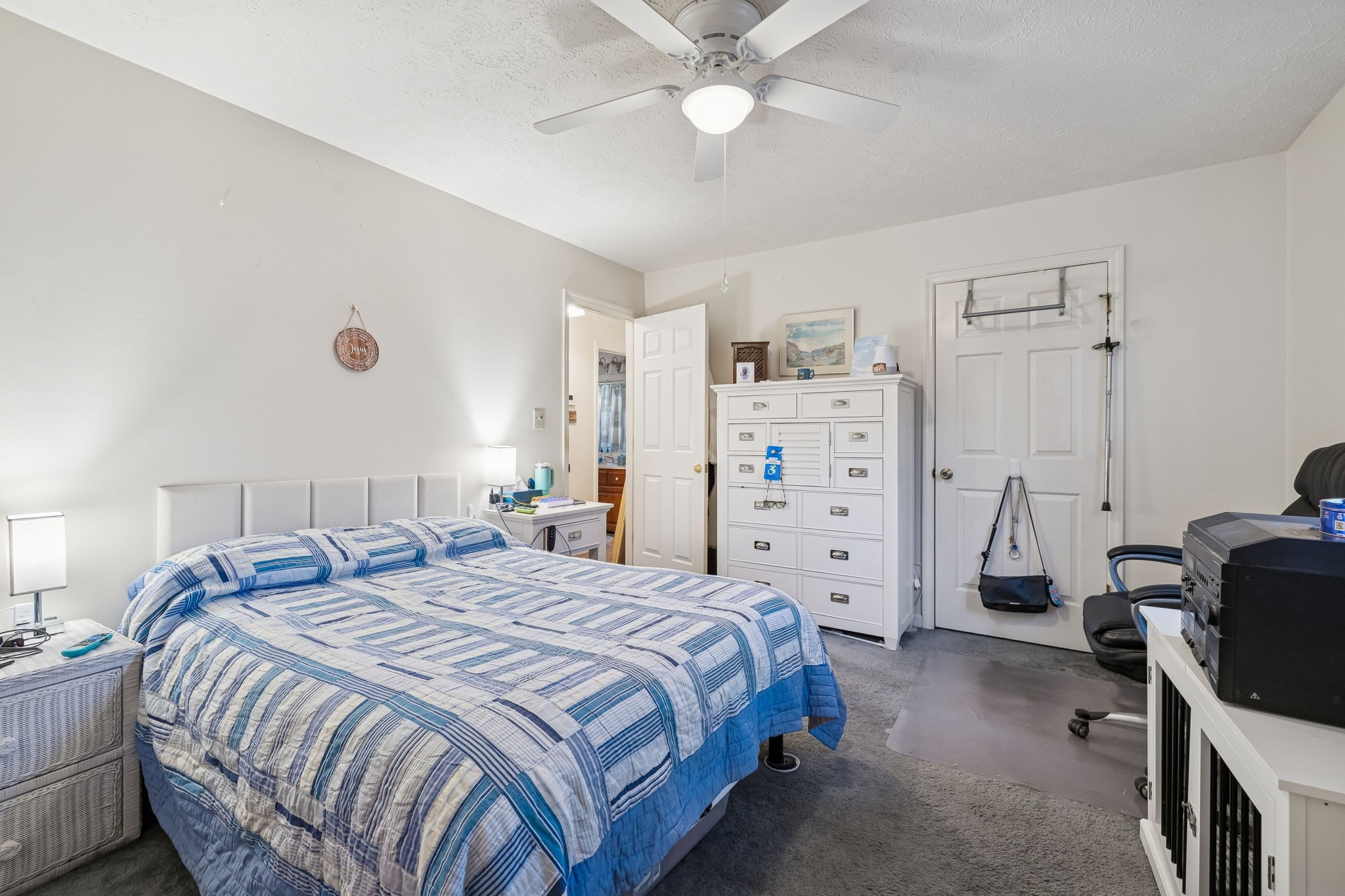 1337 Oaklawn Road Chapmansboro, TN 37035 - Photo 17 of 37 a bedroom with a bed and a chandelier